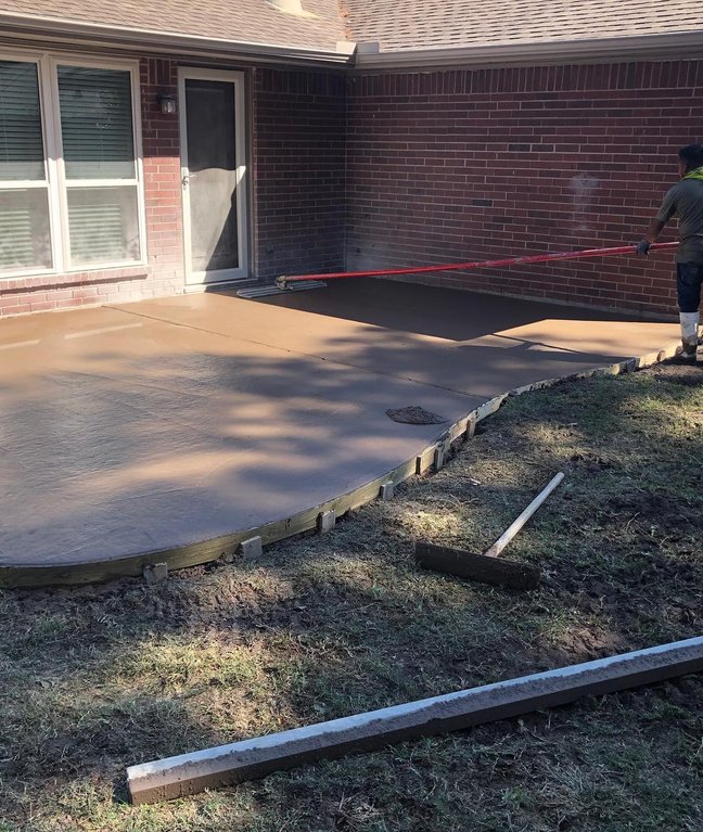 Concrete crew pouring sidewalk in New York City